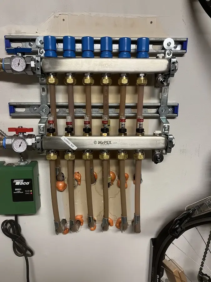 Plumber performing Water Heater Repair at a residential property in Fulshear